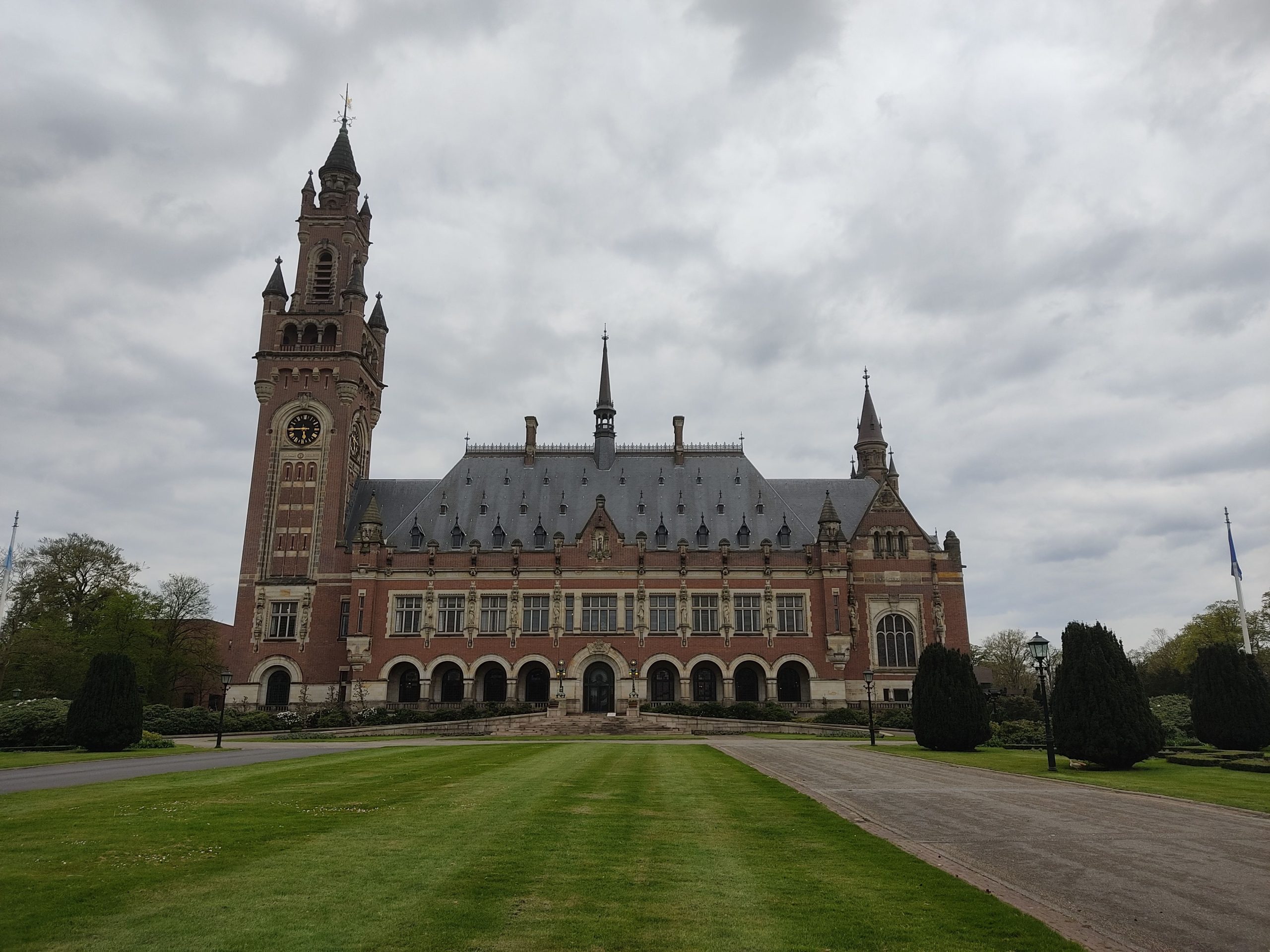 The Peace Palace in The Hague under a cloudy sky, seat of international courts