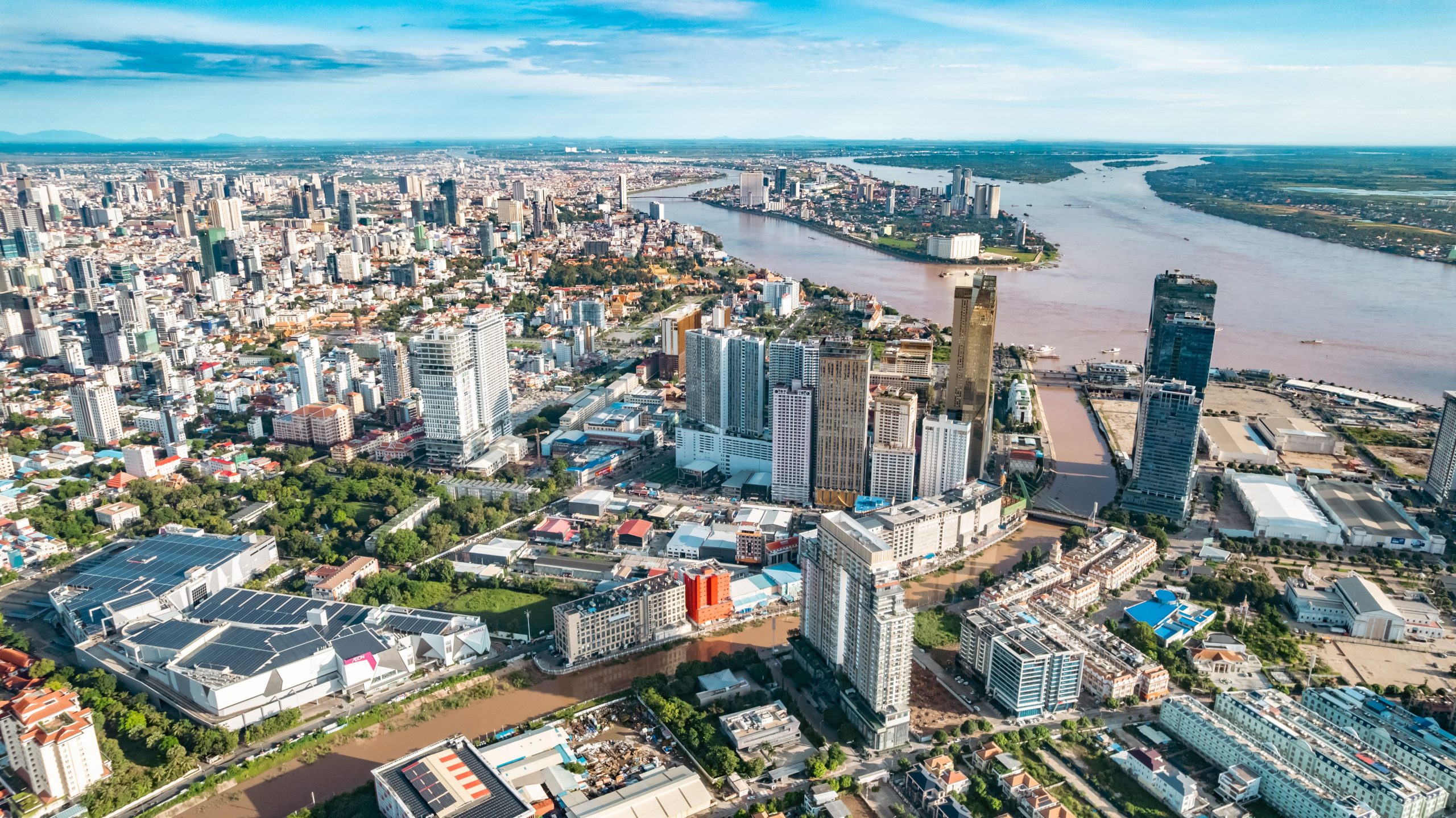 Aerial view of the bustling cityscape of Phnom Penh, Cambodia, beside the Mekong River